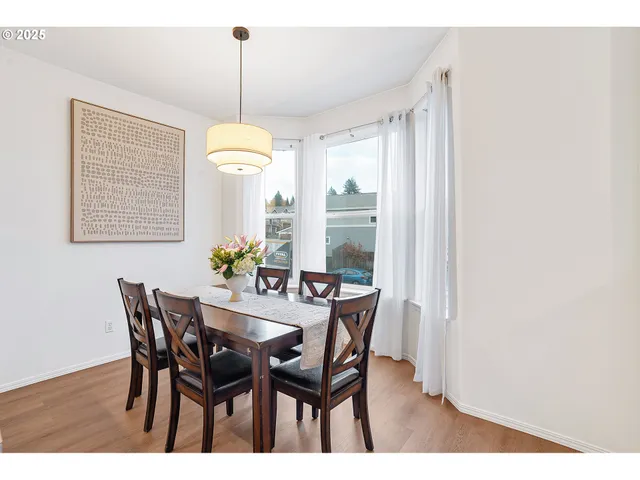 a dining room with furniture and window