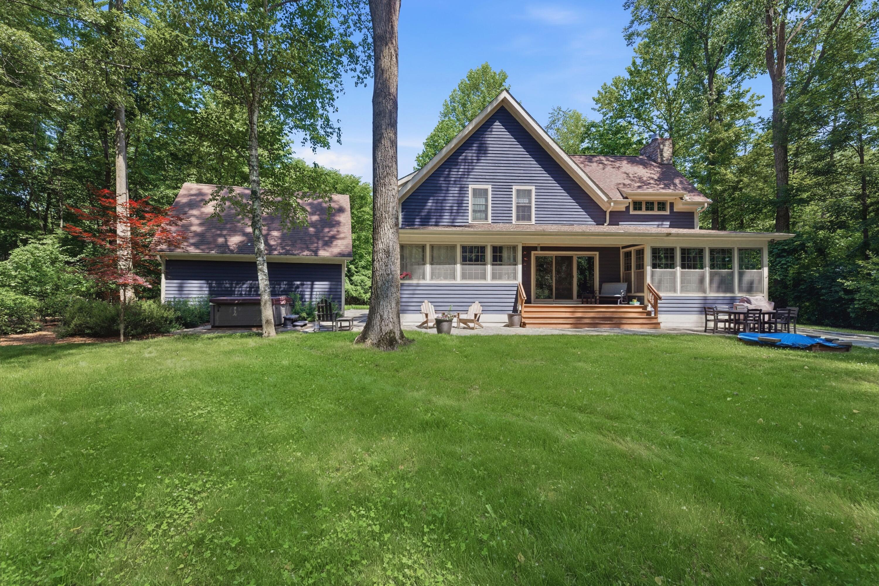 71 Timber Trail Michigan City, IN 46360 - Photo 21 of 27 a front view of a house with a yard table and chairs