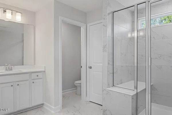 a bathroom with double sink and a mirror