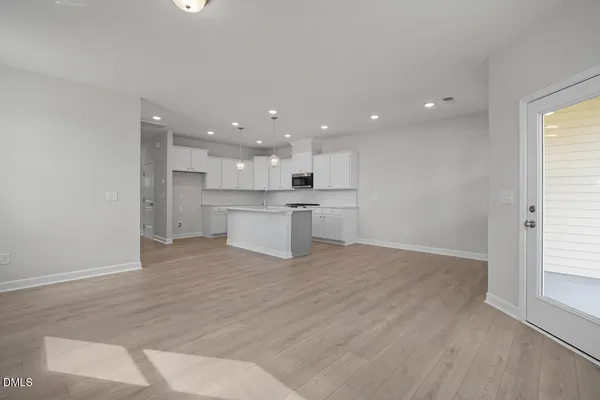 a view of kitchen with wooden floor