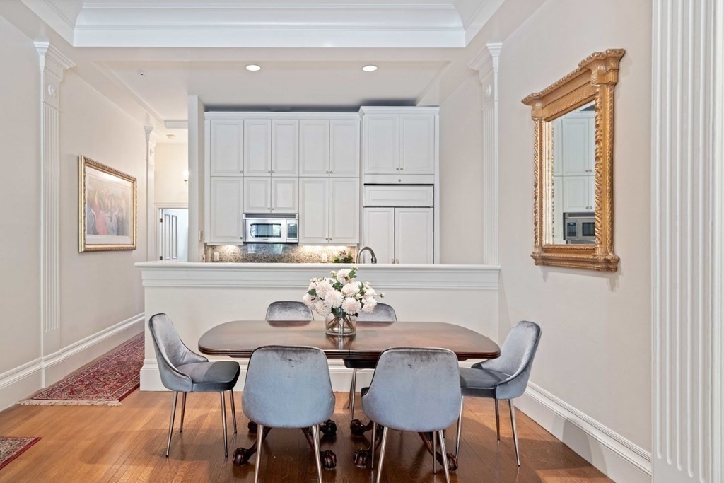 226 Commonwealth Avenue, Unit 1 Boston, MA 02116 - Photo 5 of 17 a view of a dining room with furniture and wooden floor
