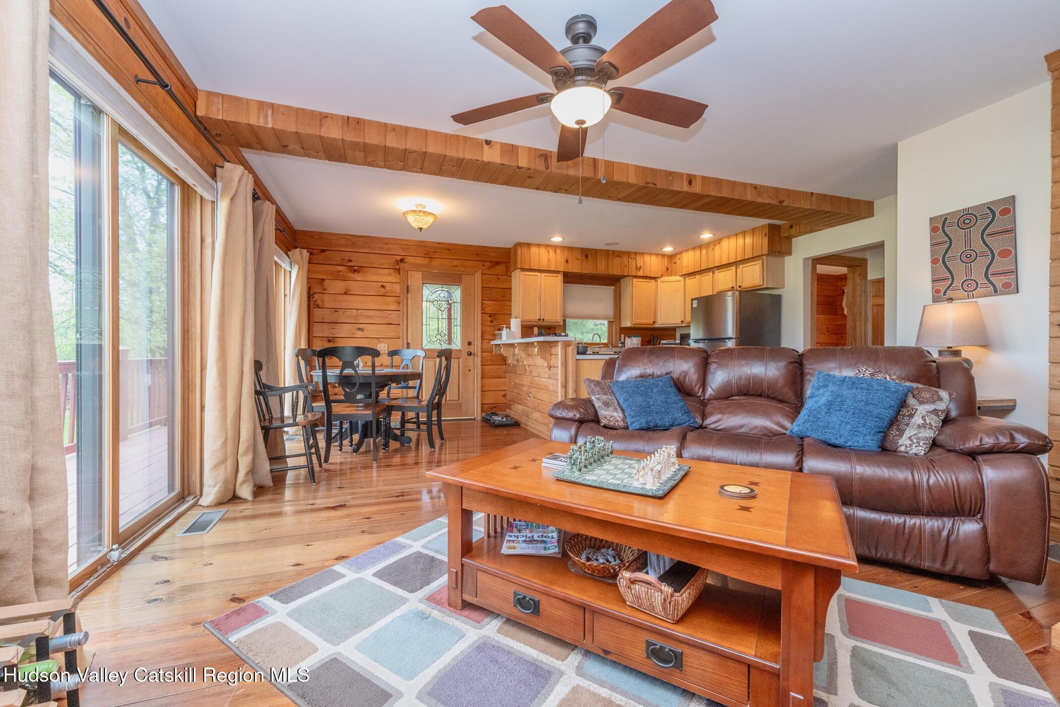 140 Stone Dock Road High Falls, NY 12440 - Photo 5 of 42 a living room with furniture a dining table and chairs with a large window