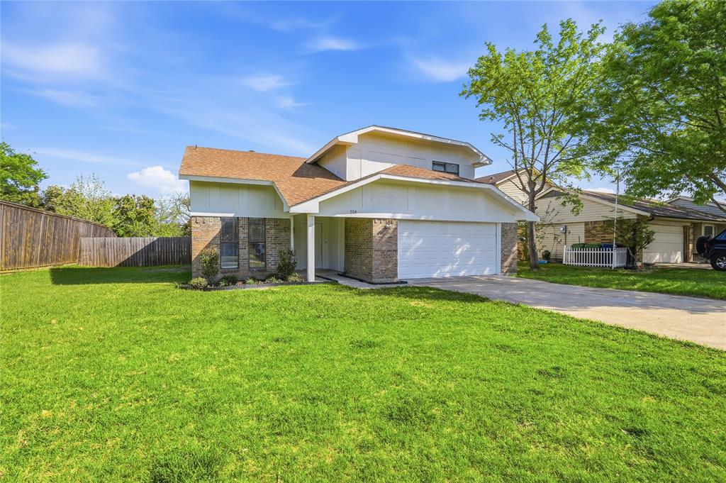 5514 Round Rock Road Garland, TX 75044 - Photo 1 of 37 a front view of a house with a yard and garage