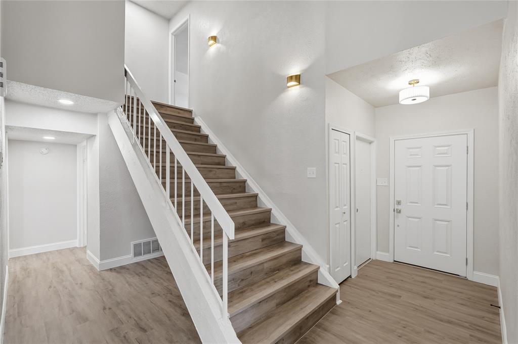 5514 Round Rock Road Garland, TX 75044 - Photo 19 of 37 a view of entryway and hall with wooden floor