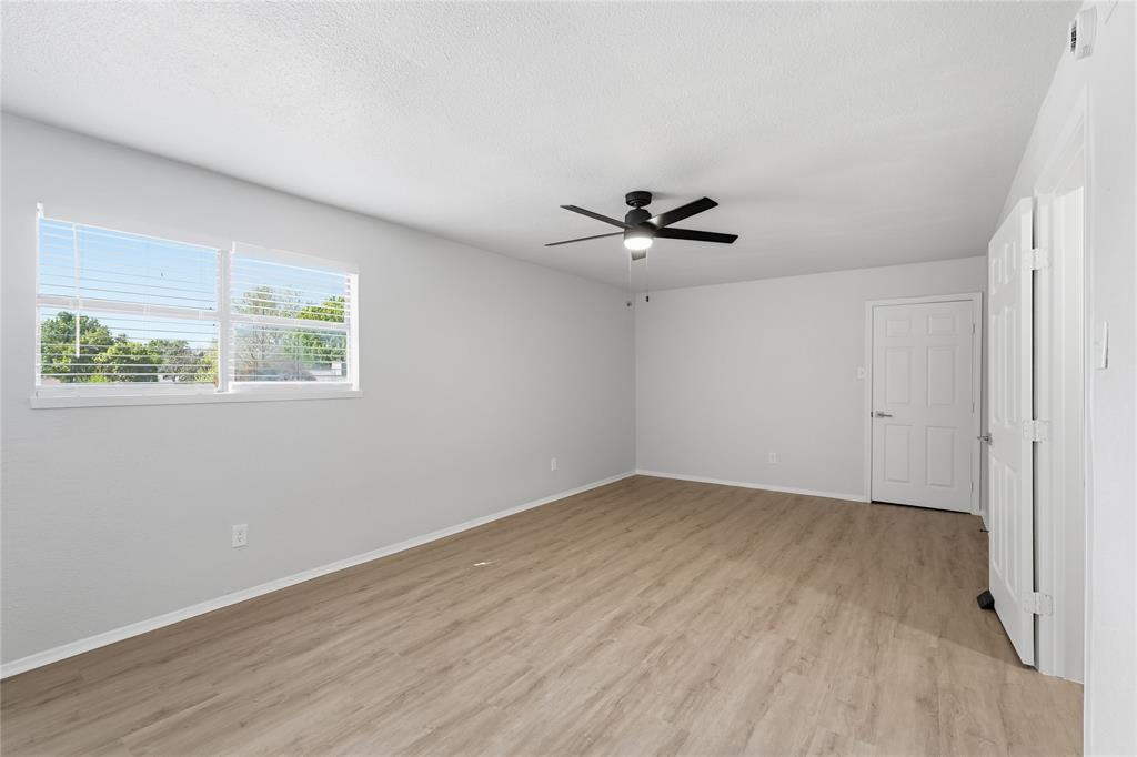 5514 Round Rock Road Garland, TX 75044 - Photo 20 of 37 a view of a room with wooden floor and natural light