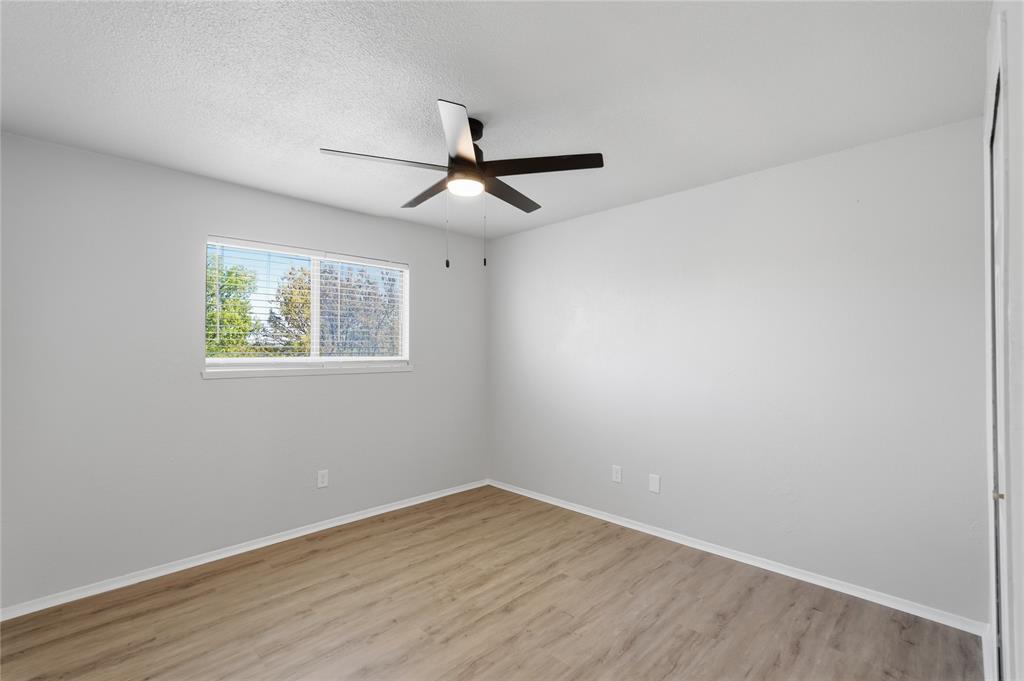 5514 Round Rock Road Garland, TX 75044 - Photo 24 of 37 a view of empty room with wooden floor