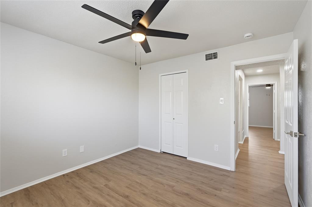 5514 Round Rock Road Garland, TX 75044 - Photo 25 of 37 wooden floor in an empty room