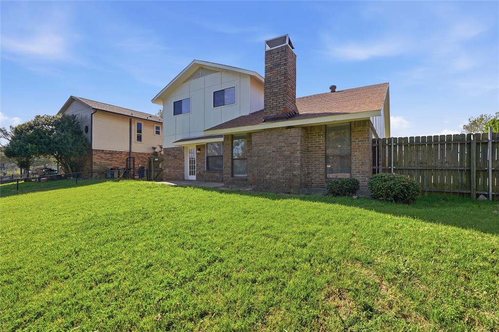 5514 Round Rock Road Garland, TX 75044 - Photo 28 of 37 a front view of a house with garden
