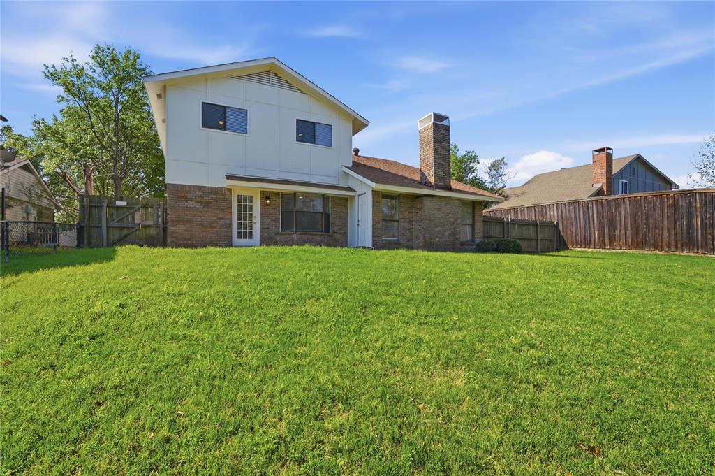 5514 Round Rock Road Garland, TX 75044 - Photo 30 of 37 a view of a house with a yard