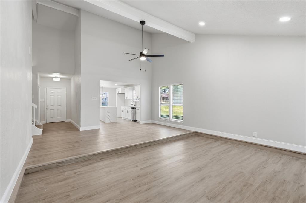 5514 Round Rock Road Garland, TX 75044 - Photo 3 of 37 wooden floor in an empty room with a window