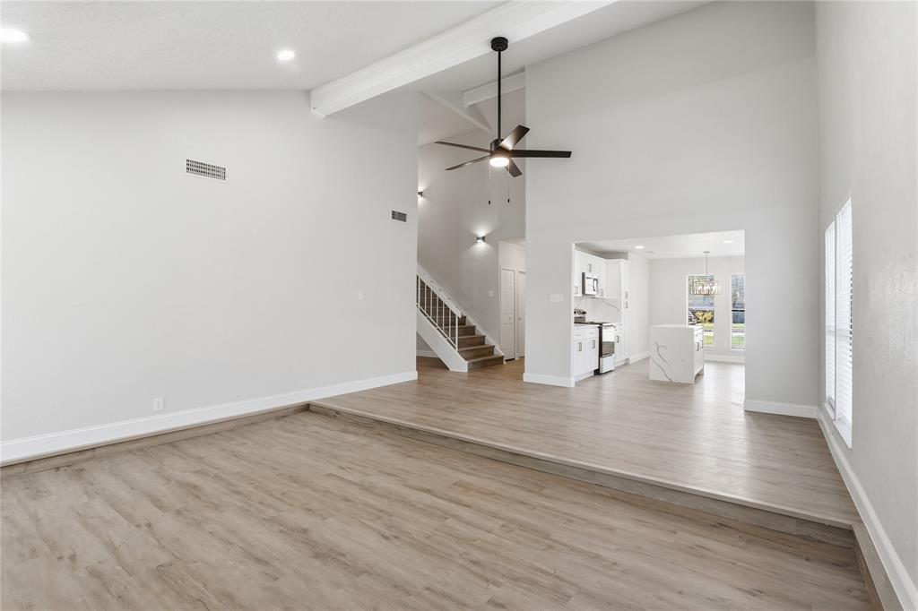 5514 Round Rock Road Garland, TX 75044 - Photo 4 of 37 a view of a livingroom with wooden floor and staircase