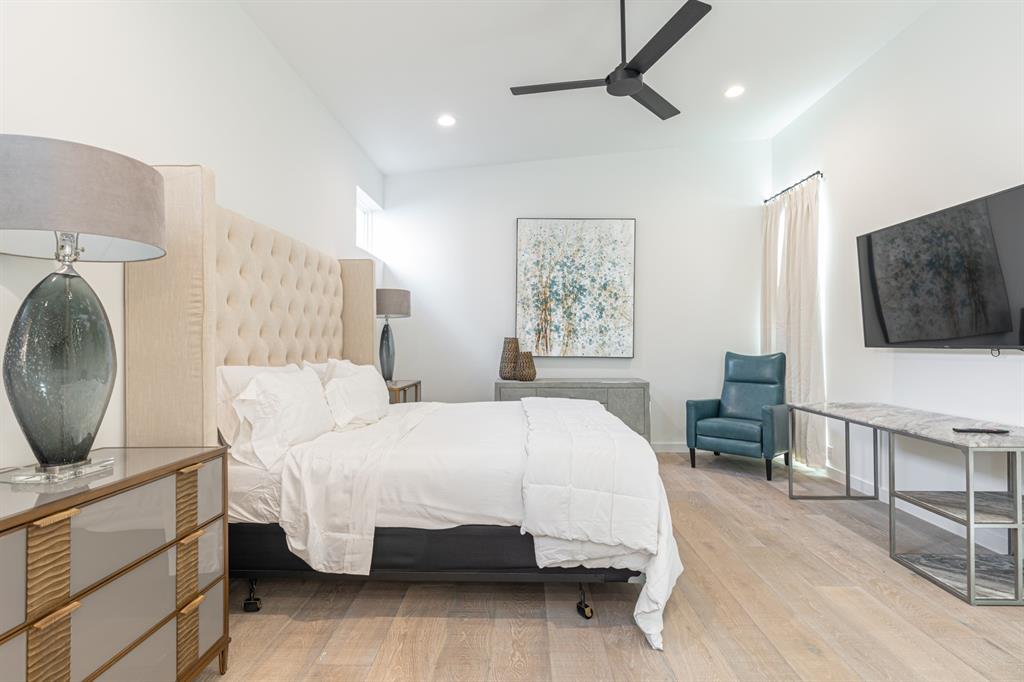 4202 Bonham Street Dallas, TX 75229 - Photo 14 of 32 Bedroom with wood finished floors, recessed lighting, radiator heating unit, and ceiling fan