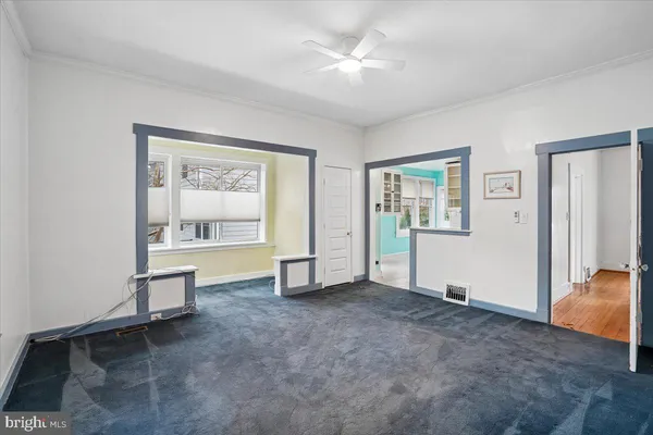 a view of an empty room with a window