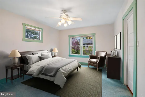 a bedroom with bed and window