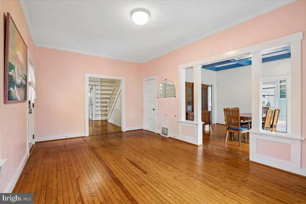 a view of a livingroom with furniture and hardwood floor