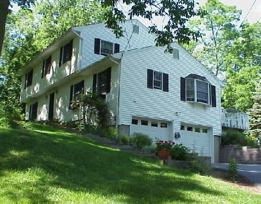 48 High Pastures Court Ridgefield, CT 06877 - Photo 1 of 1 a front view of house with yard and green space