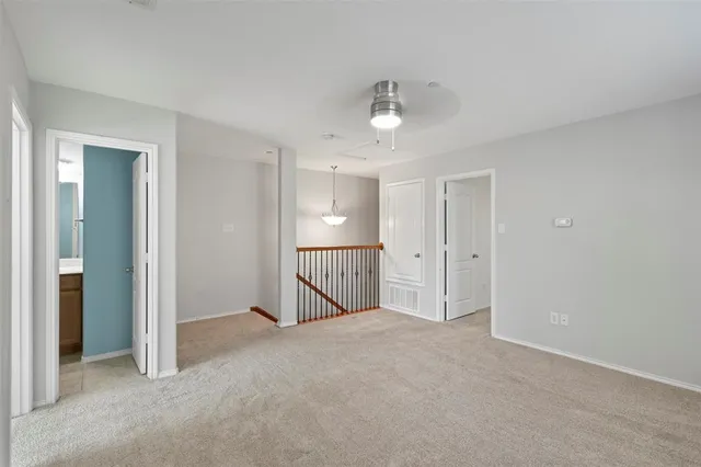 a view of an empty room with a bathroom