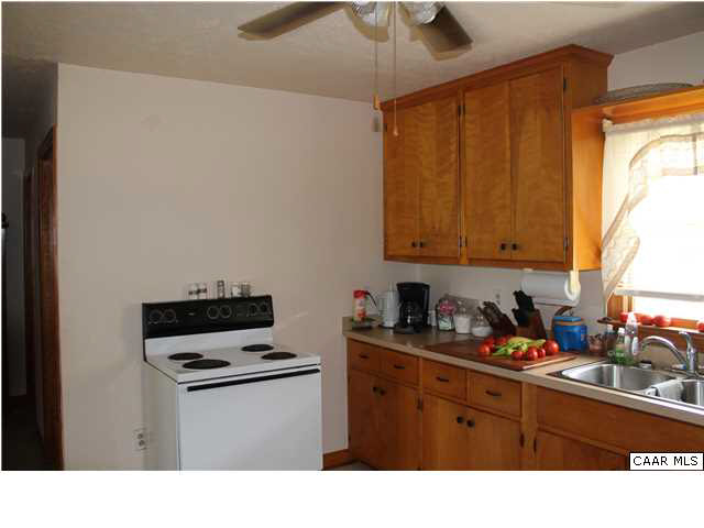 4605 Wesley Chapel Road Free Union, VA 22940 - Photo 3 of 13 a kitchen with a stove a sink and a cabinets