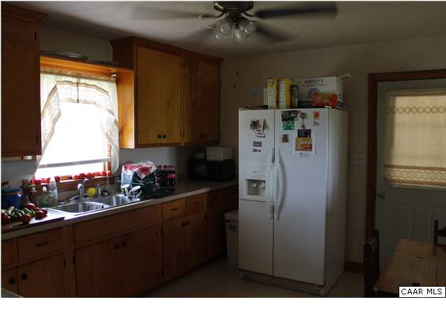4605 Wesley Chapel Road Free Union, VA 22940 - Photo 4 of 13 a room with refrigerator and window