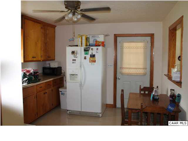 4605 Wesley Chapel Road Free Union, VA 22940 - Photo 5 of 13 a kitchen with stainless steel appliances kitchen island granite countertop a refrigerator and a sink