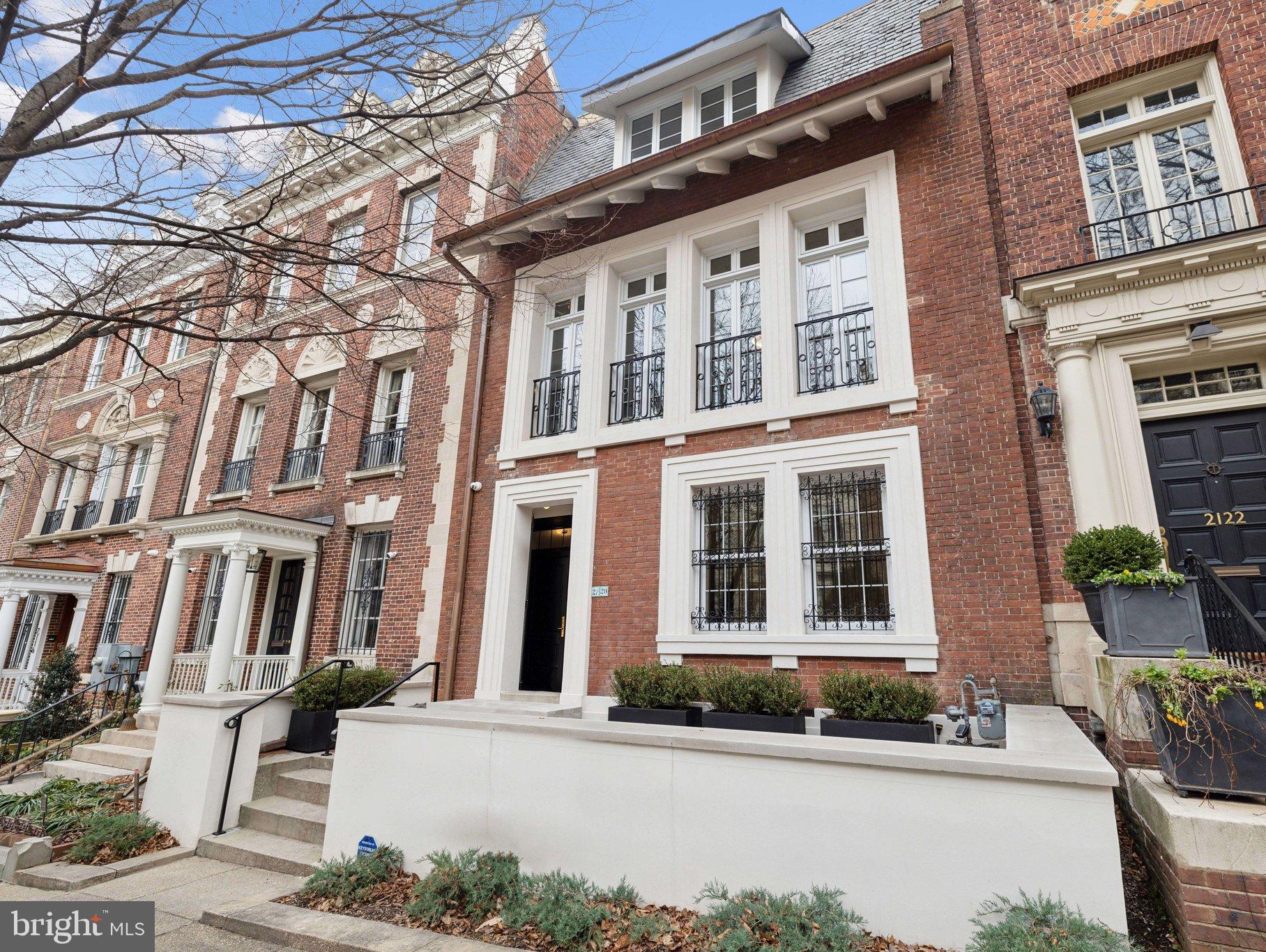 2120 Bancroft Place Northwest Washington, DC 20008 - Photo 1 of 30 a front view of a building with a street