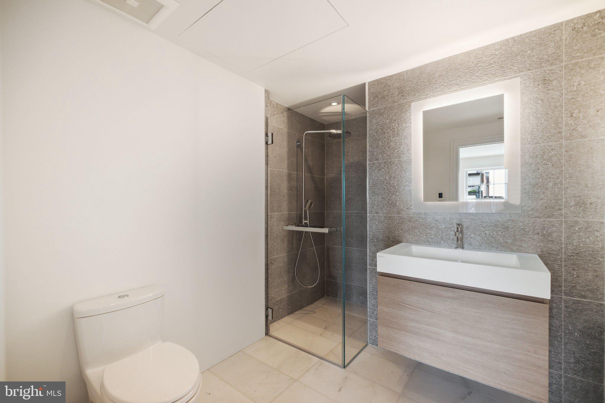 2120 Bancroft Place Northwest Washington, DC 20008 - Photo 22 of 30 a bathroom with a sink toilet and shower