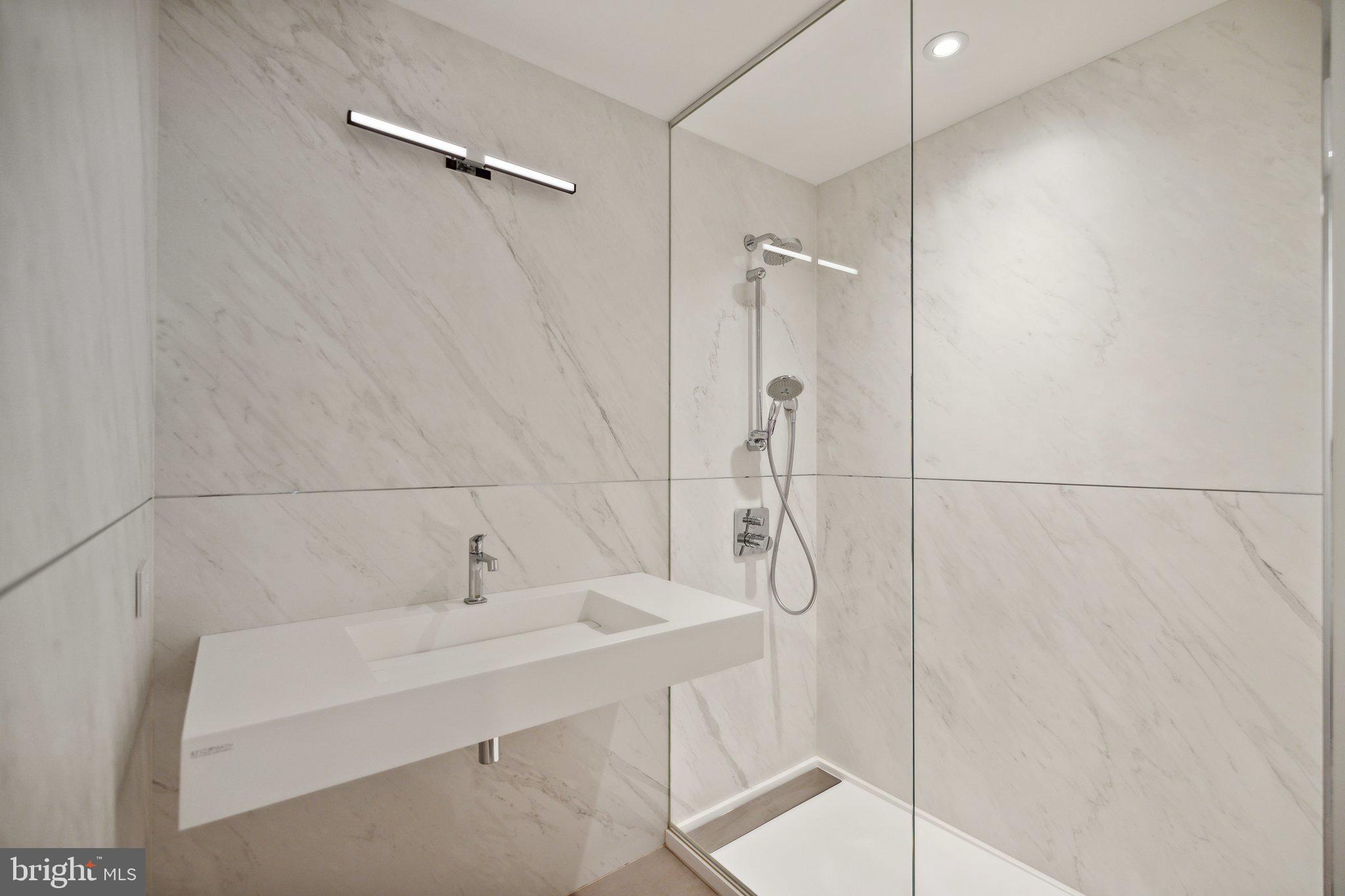 2120 Bancroft Place Northwest Washington, DC 20008 - Photo 24 of 30 a bathroom with a sink and shower