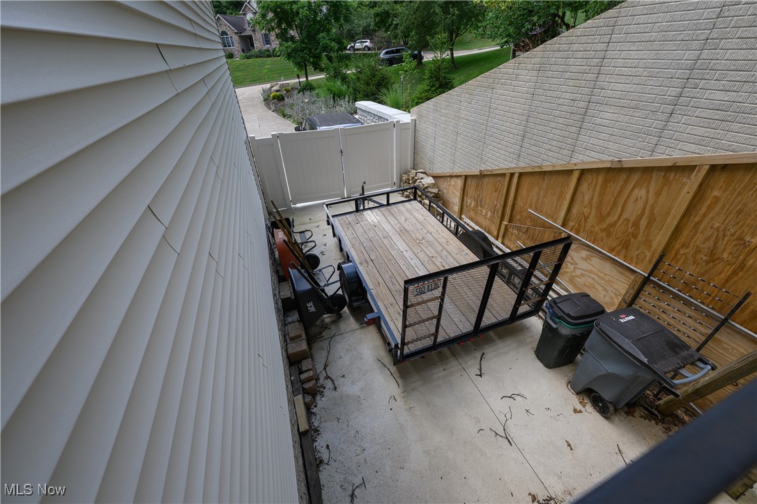 1427 Terrace Road Northwest New Philadelphia, OH 44663 - Photo 18 of 44 Wooden terrace featuring a fenced backyard