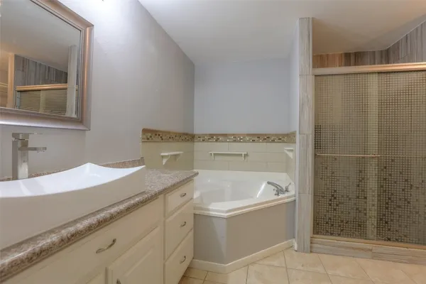 a bathroom with a bathtub and a sink