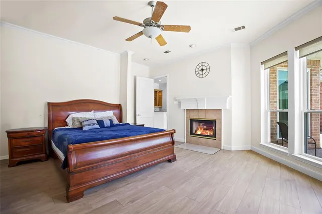 a bedroom with a bed and a fireplace