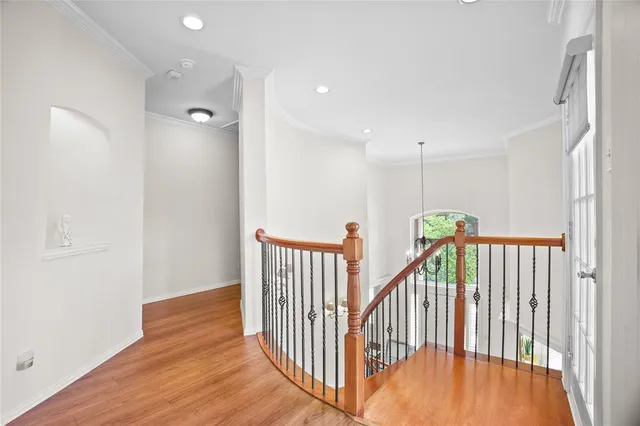 a view of hallway with wooden floor