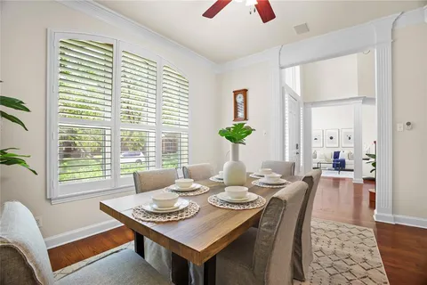 a dining room with furniture and window