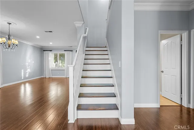 an empty room with closet and windows