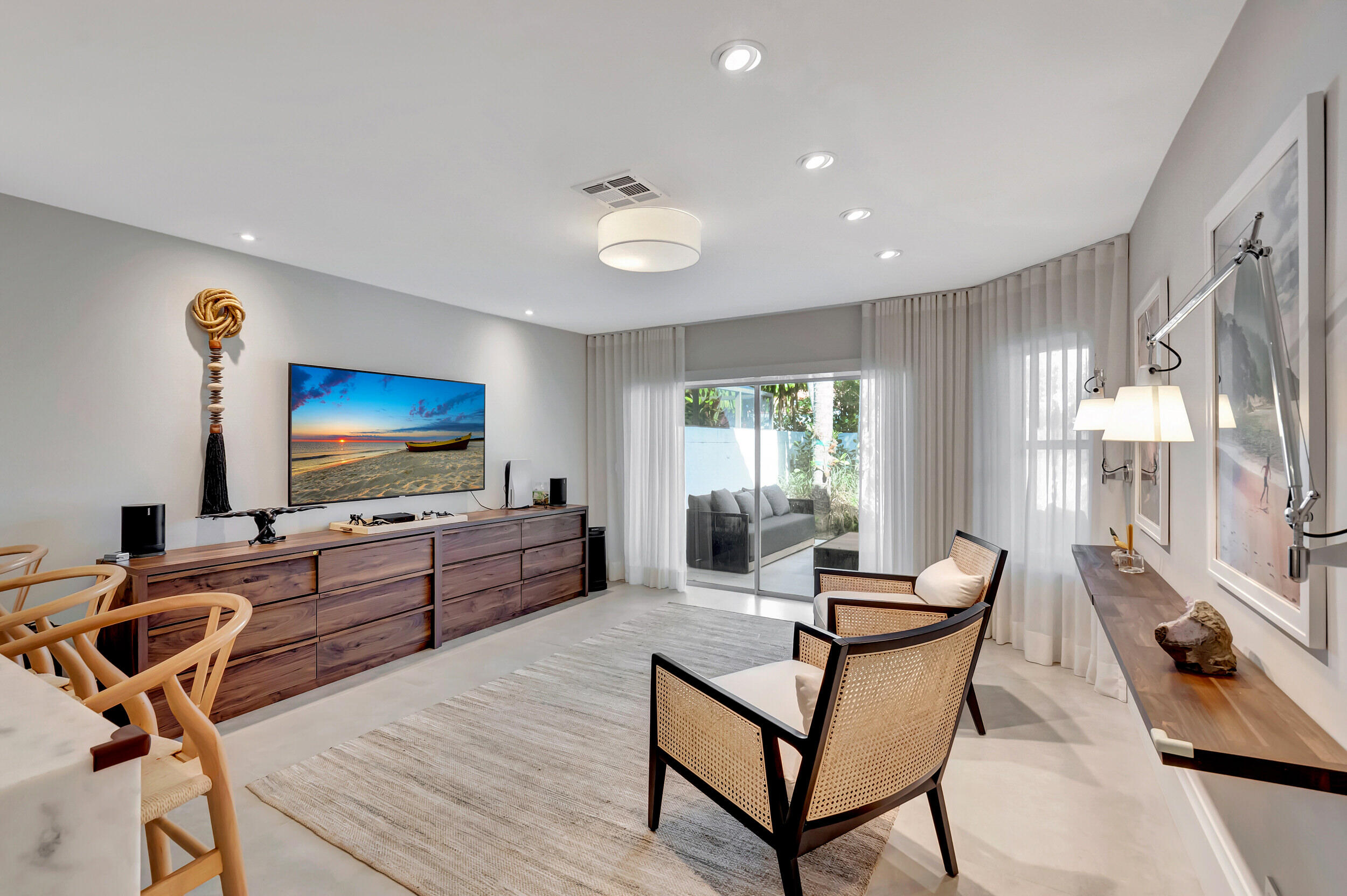 5254 Northwest 22nd Avenue Boca Raton, FL 33496 - Photo 11 of 50 a living room with furniture and a flat screen tv