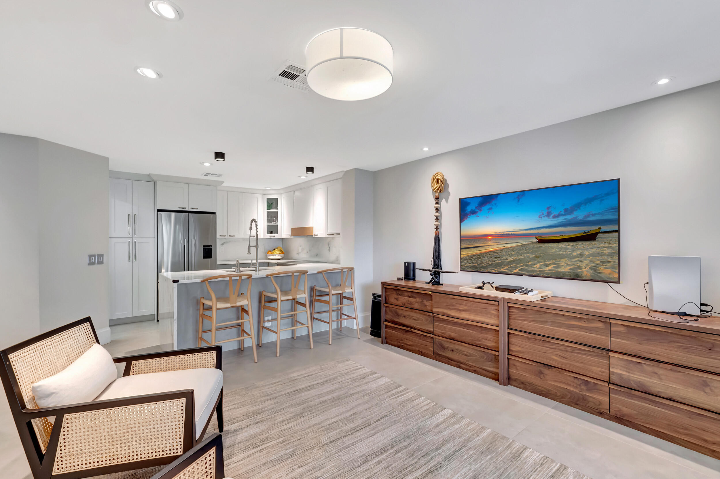5254 Northwest 22nd Avenue Boca Raton, FL 33496 - Photo 14 of 50 a living room with furniture and a flat screen tv