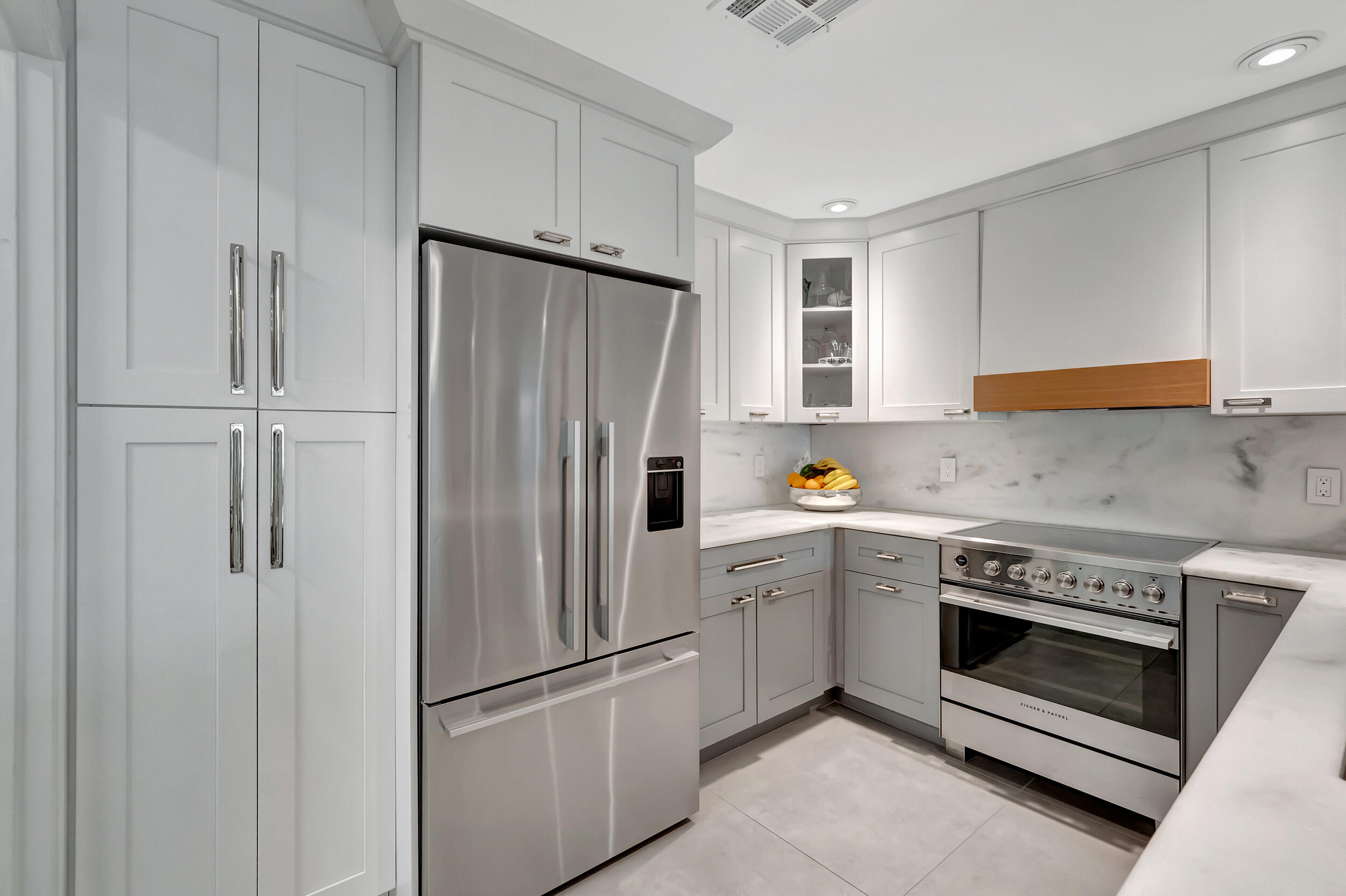 5254 Northwest 22nd Avenue Boca Raton, FL 33496 - Photo 17 of 50 a kitchen with a refrigerator sink and stove
