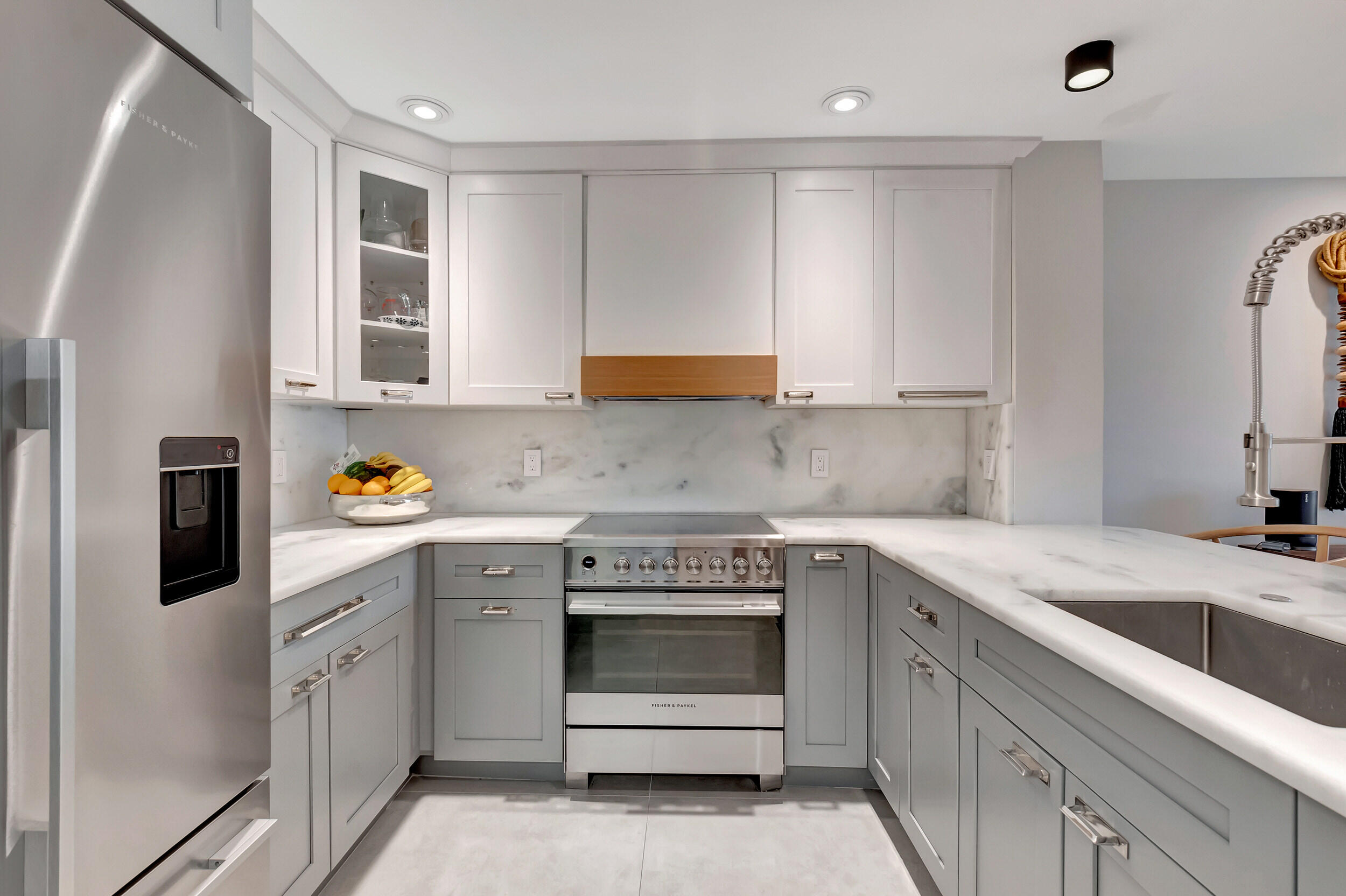 5254 Northwest 22nd Avenue Boca Raton, FL 33496 - Photo 18 of 50 a kitchen with a stove sink and cabinets