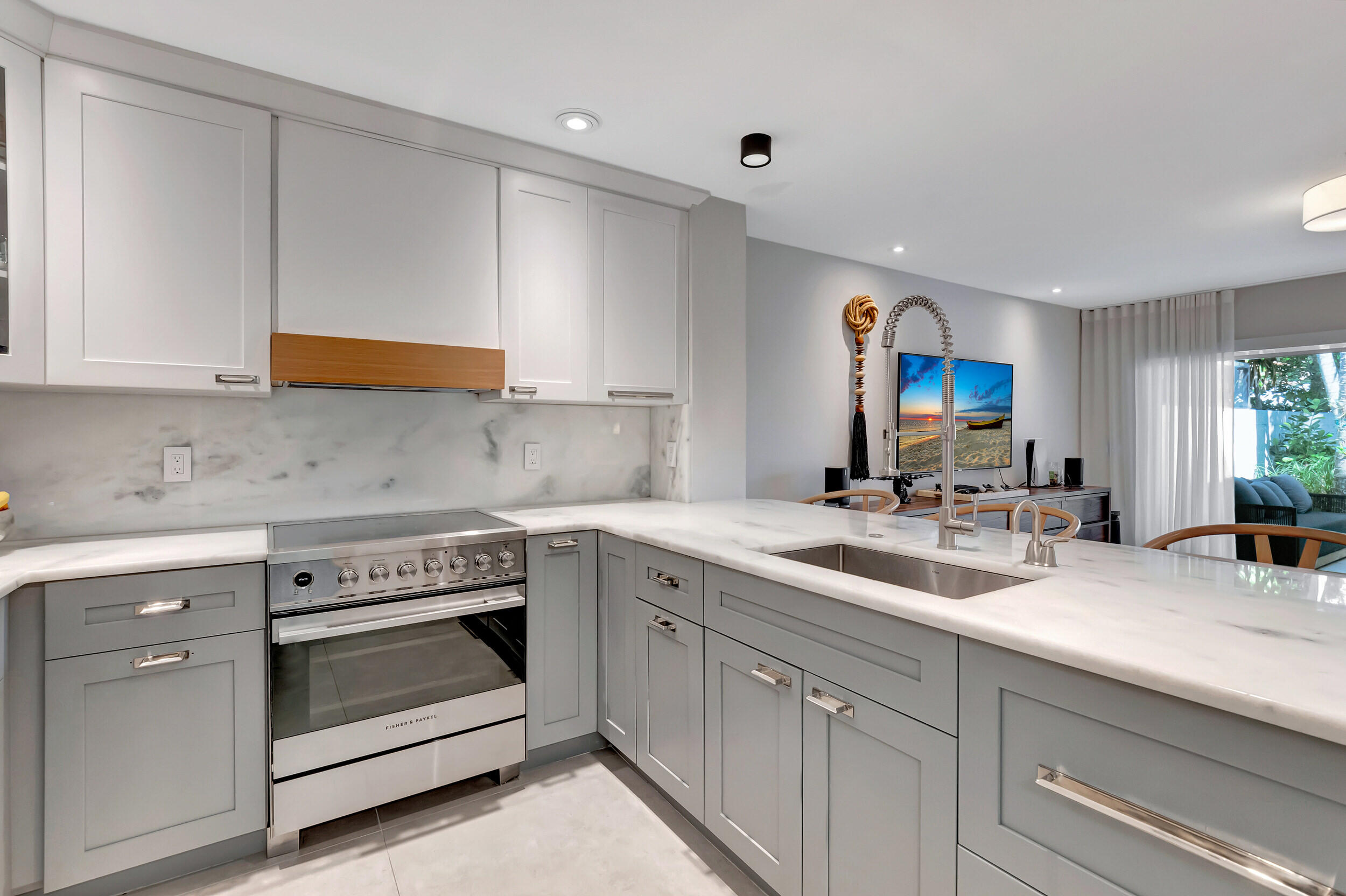 5254 Northwest 22nd Avenue Boca Raton, FL 33496 - Photo 19 of 50 a kitchen with a sink stove and cabinets