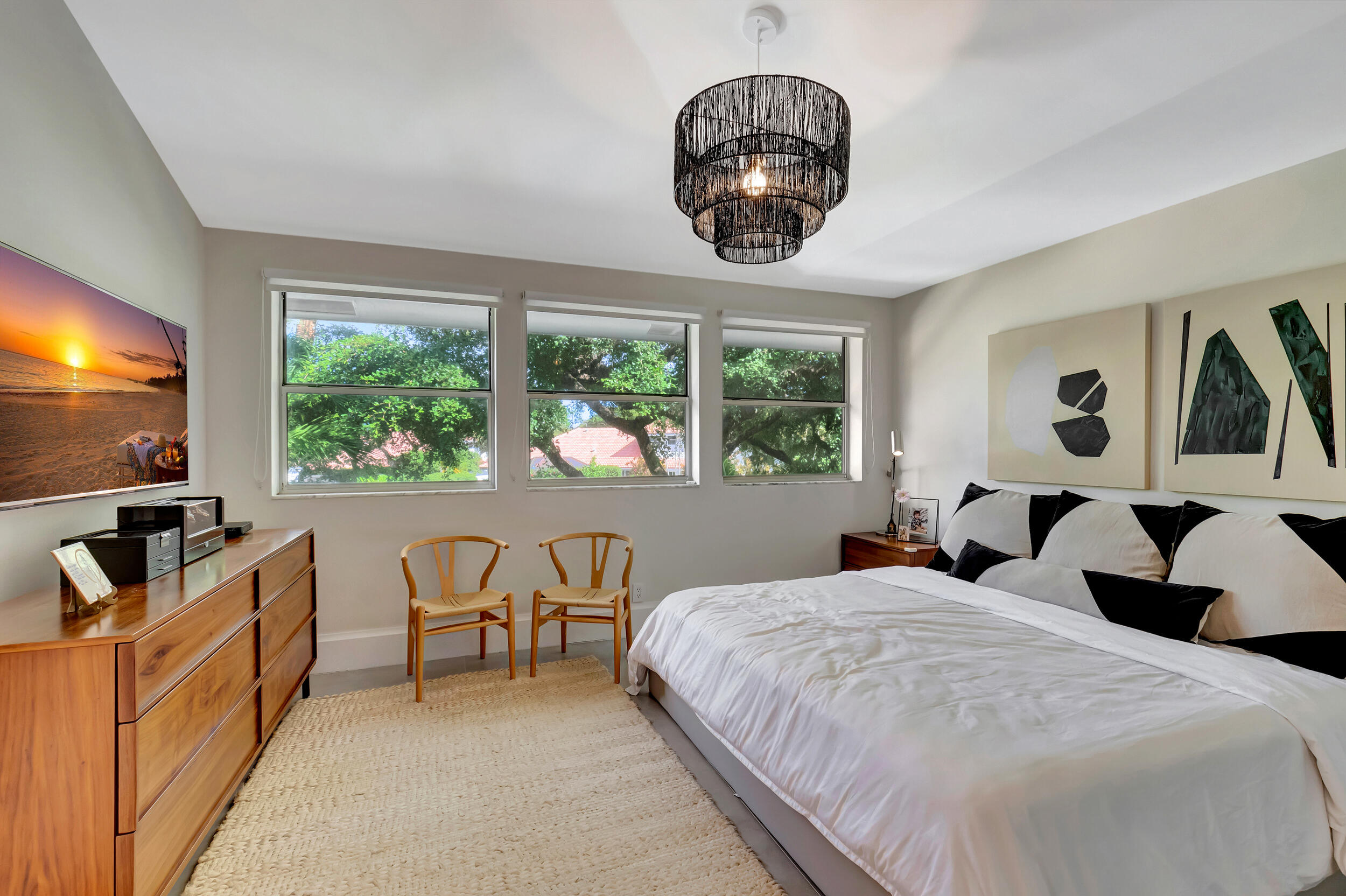 5254 Northwest 22nd Avenue Boca Raton, FL 33496 - Photo 24 of 50 a bedroom with bed and glass windows