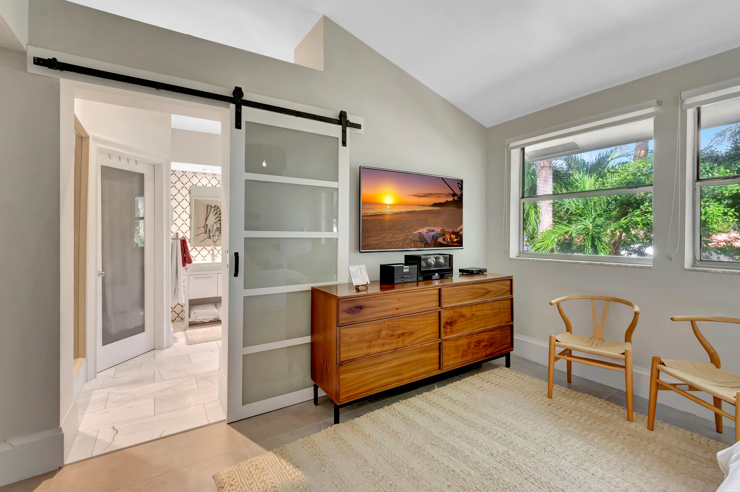 5254 Northwest 22nd Avenue Boca Raton, FL 33496 - Photo 25 of 50 a room with furniture and flat screen tv