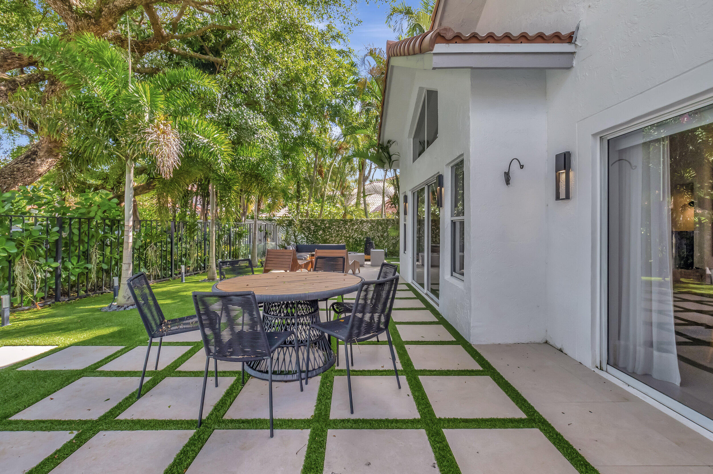 5254 Northwest 22nd Avenue Boca Raton, FL 33496 - Photo 31 of 50 a view of backyard with a patio and outdoor seating