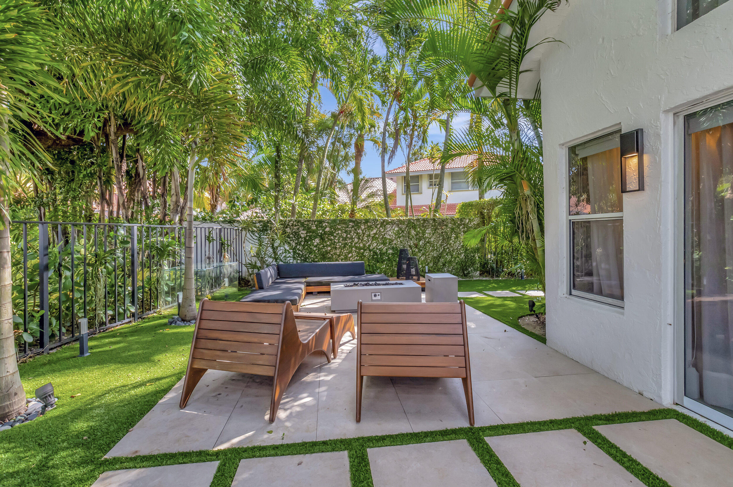 5254 Northwest 22nd Avenue Boca Raton, FL 33496 - Photo 35 of 50 a view of a chairs and table in backyard of the house