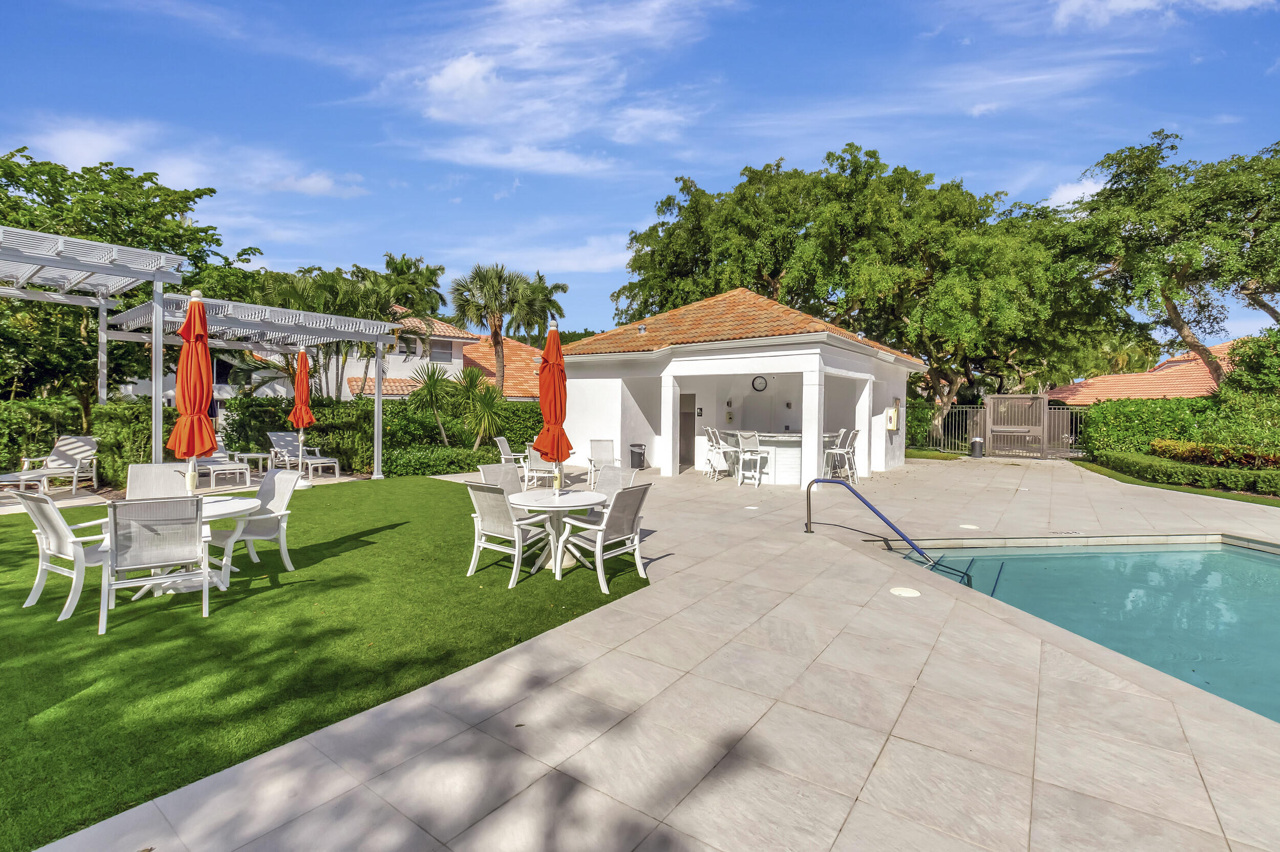 5254 Northwest 22nd Avenue Boca Raton, FL 33496 - Photo 39 of 50 a view of a house with backyard sitting area and garden