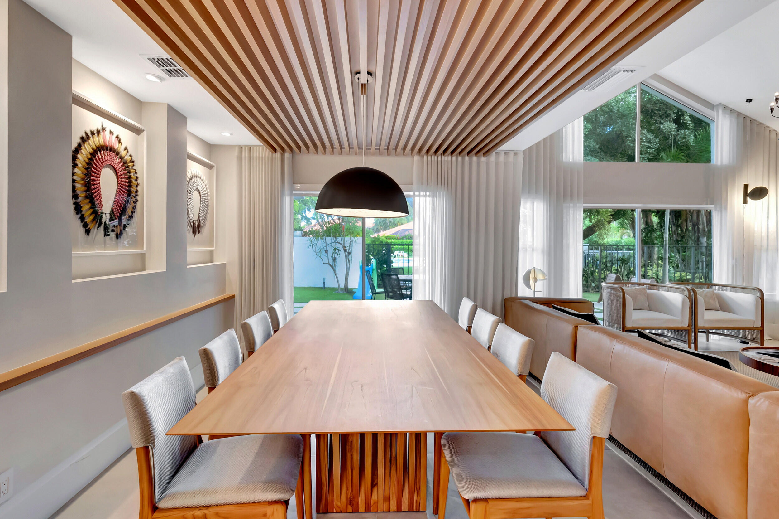 5254 Northwest 22nd Avenue Boca Raton, FL 33496 - Photo 9 of 50 a view of a dining room with furniture window and wooden floor