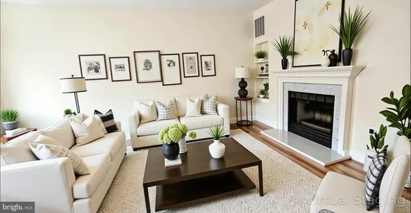 a living room with furniture and a fireplace