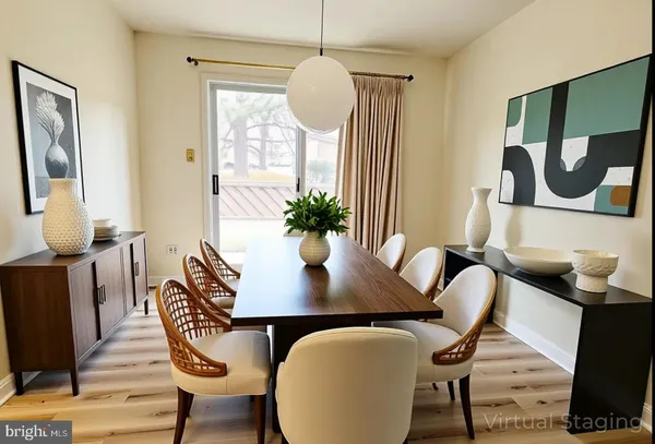 a view of a dining room with furniture window and wooden floor