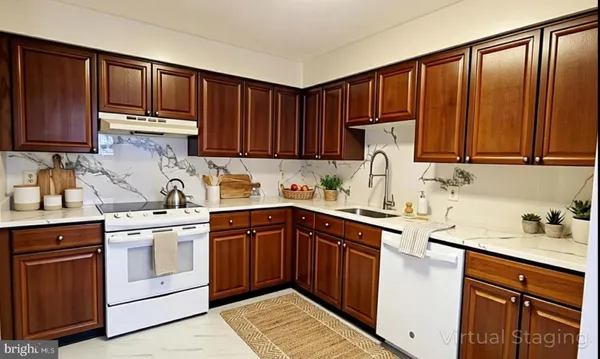 a kitchen with a sink stove and cabinets