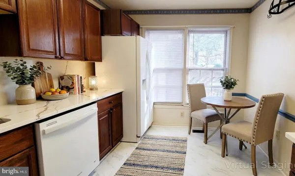 a kitchen with a sink cabinets and window