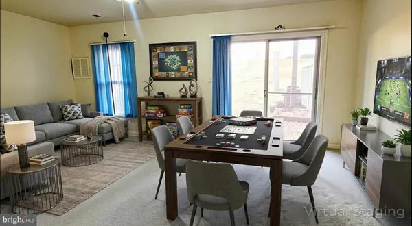 a view of a dining room with furniture window and outside view