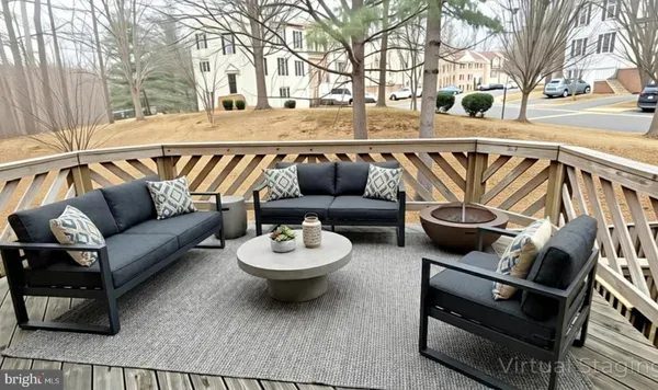 a view of a patio with couches and pool